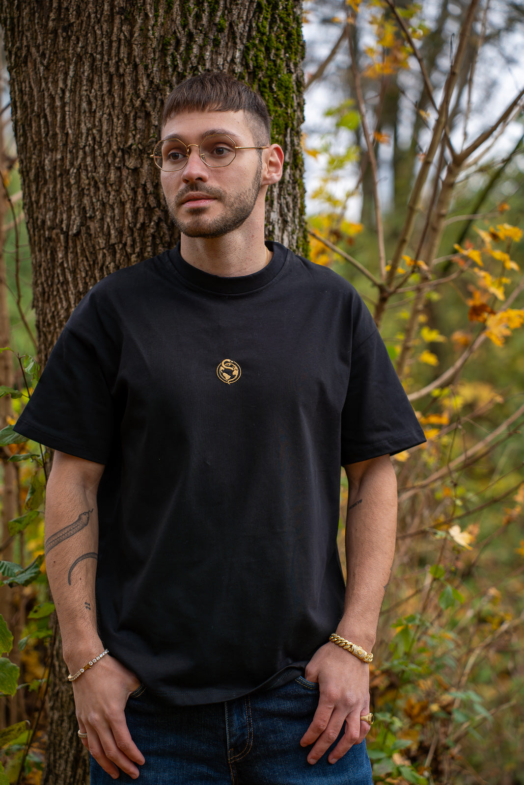 Black and gold Snake Tee worn, front view